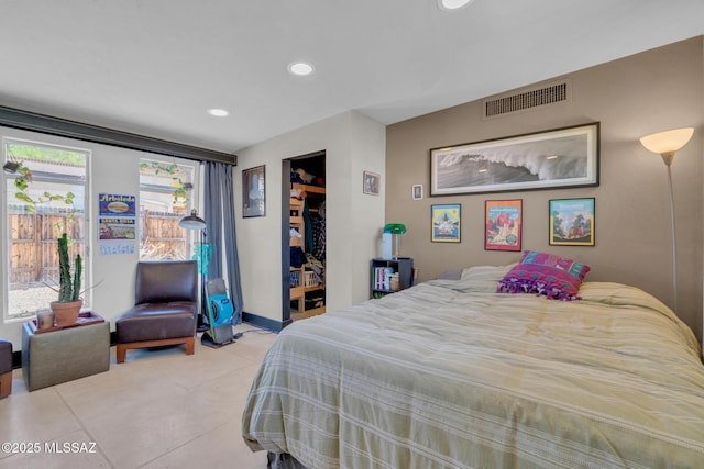 2716 E 6th St, Tucson, AZ 85716 - bedroom featuring light tile patterned floors, recessed lighting, and baseboards