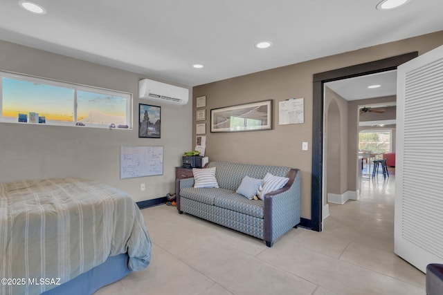 2716 E 6th St, Tucson, AZ 85716 - bedroom featuring a wall mounted AC, baseboards, recessed lighting, and light tile patterned floors