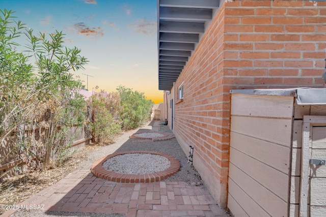 2716 E 6th St, Tucson, AZ 85716 - view of home's exterior featuring brick siding and a patio