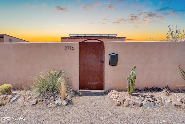 2716 E 6th St, Tucson, AZ 85716 - view of exterior entry with stucco siding