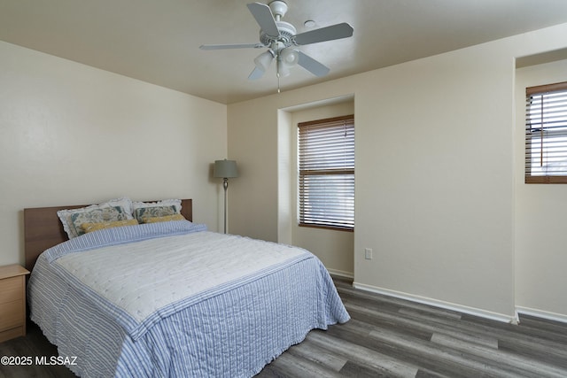 bedroom featuring ceiling fan, wood finished floors, and baseboards