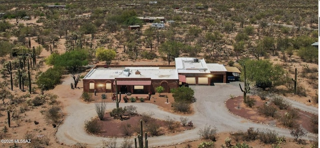 birds eye view of property with a rural view and view of desert