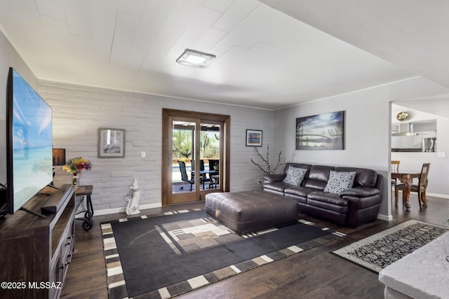 living area with baseboards and dark wood-style flooring
