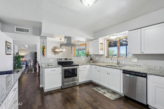 kitchen with dark wood-style flooring, a sink, stainless steel appliances, island range hood, and visible vents