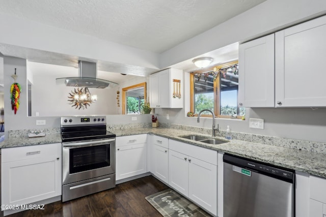 kitchen featuring island range hood, dark wood-type flooring, white cabinetry, a sink, and stainless steel appliances