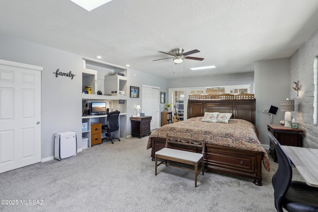 bedroom with a ceiling fan, baseboards, and light carpet