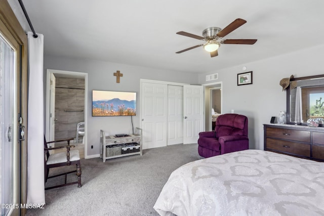 bedroom with a ceiling fan, visible vents, baseboards, a closet, and carpet flooring