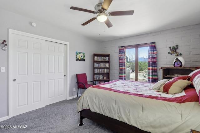 carpeted bedroom featuring a closet and a ceiling fan