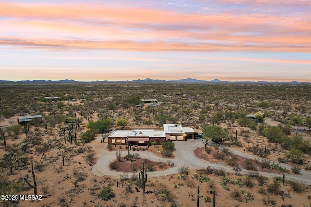 birds eye view of property with a desert view, a mountain view, and a rural view