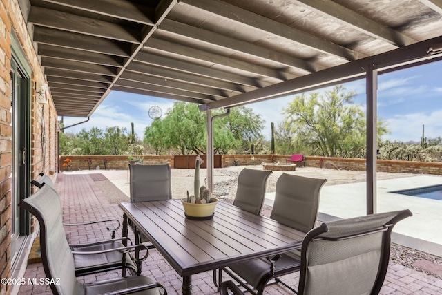 view of patio with a fenced in pool, outdoor dining area, and a fenced backyard