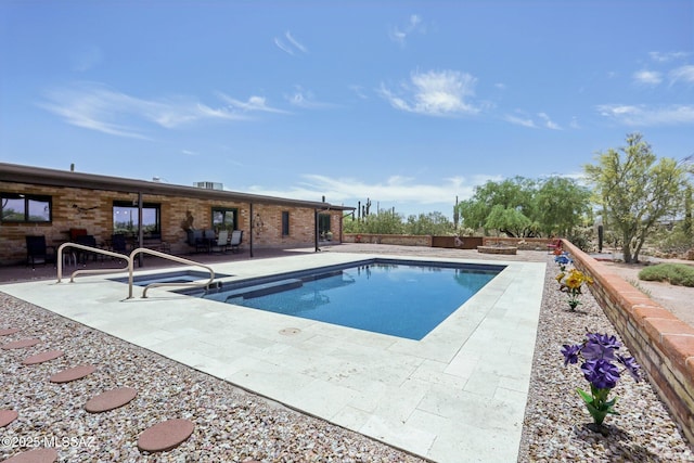 pool featuring a patio area