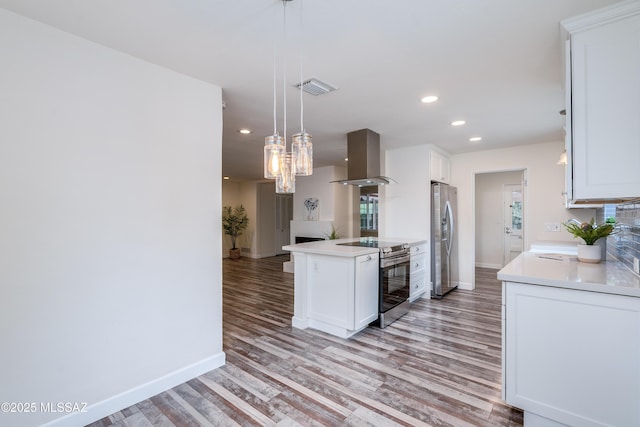38 N Irving Ave, Tucson, AZ 85711 - kitchen with ventilation hood, baseboards, visible vents, recessed lighting, and appliances with stainless steel finishes