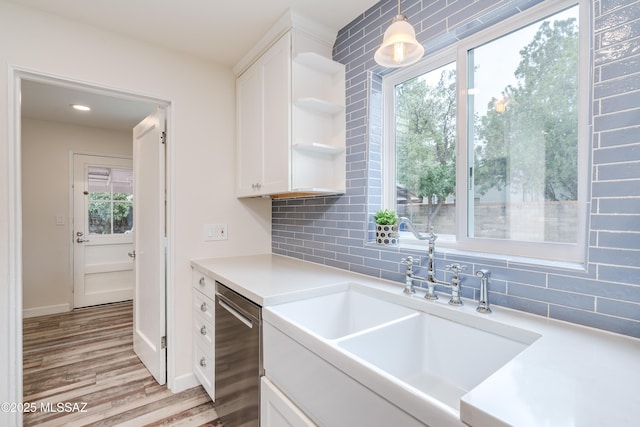 38 N Irving Ave, Tucson, AZ 85711 - kitchen featuring stainless steel dishwasher, a sink, plenty of natural light, white cabinetry, and open shelves