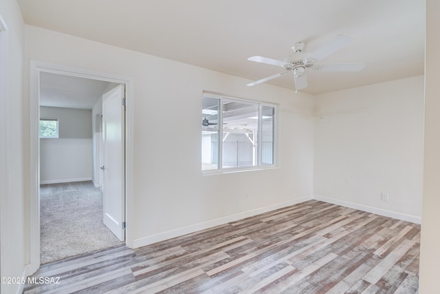 38 N Irving Ave, Tucson, AZ 85711 - spare room with baseboards, a ceiling fan, and wood finished floors