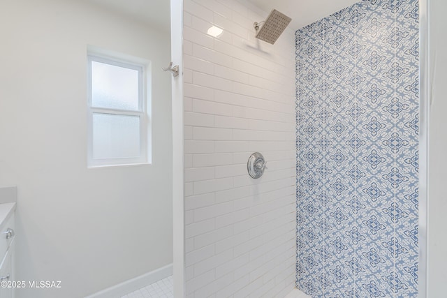 38 N Irving Ave, Tucson, AZ 85711 - bathroom featuring a tile shower and baseboards
