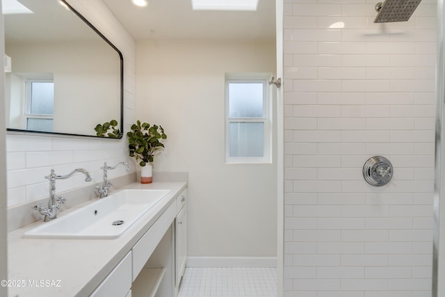 38 N Irving Ave, Tucson, AZ 85711 - bathroom featuring plenty of natural light, vanity, tile patterned flooring, and tiled shower