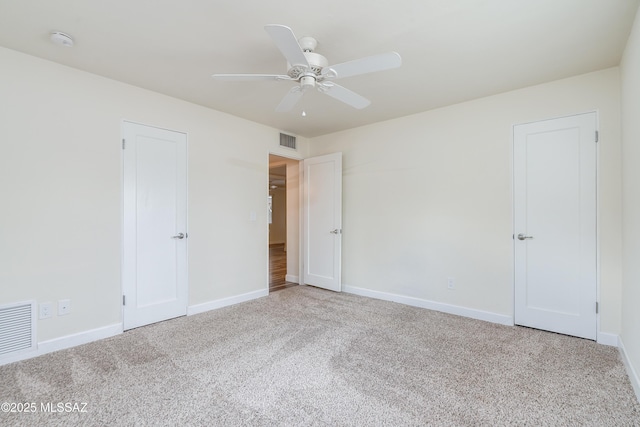 38 N Irving Ave, Tucson, AZ 85711 - unfurnished bedroom with baseboards, visible vents, and carpet floors