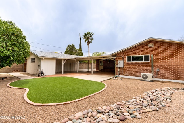 38 N Irving Ave, Tucson, AZ 85711 - back of property featuring brick siding, an attached carport, ac unit, and a patio