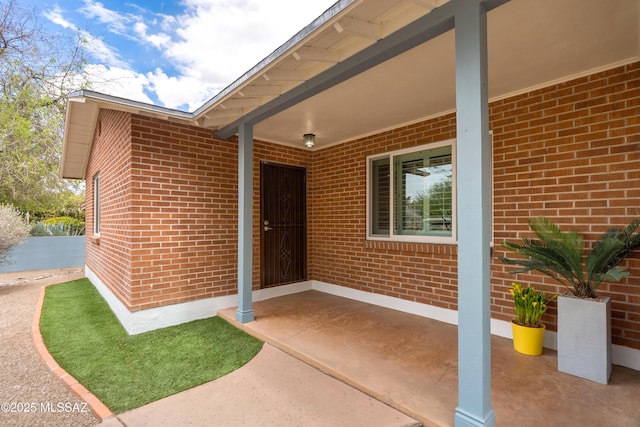 38 N Irving Ave, Tucson, AZ 85711 - view of exterior entry featuring brick siding