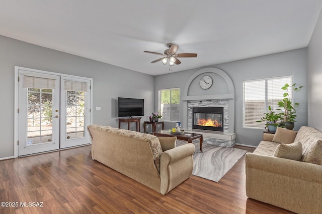 living area featuring ceiling fan, french doors, and dark wood-type flooring