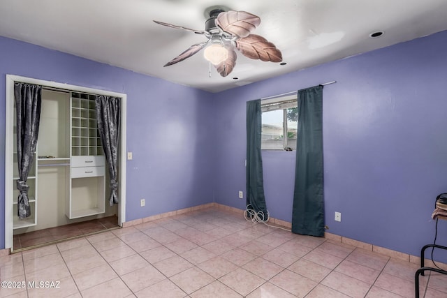 414 E 34th St, Tucson, AZ 85713 - empty room with light tile patterned floors, baseboards, and a ceiling fan