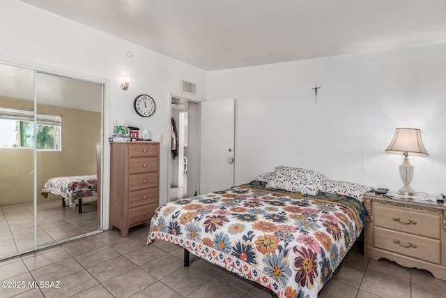 414 E 34th St, Tucson, AZ 85713 - bedroom featuring light tile patterned floors, a closet, and visible vents