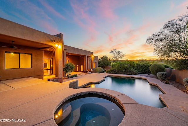 5327 N Ventana Overlook Pl, Tucson, AZ 85750 - pool at dusk with a patio, an in ground hot tub, an outdoor pool, and ceiling fan