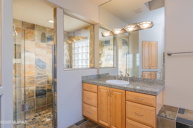 5327 N Ventana Overlook Pl, Tucson, AZ 85750 - bathroom featuring visible vents, a stall shower, and vanity