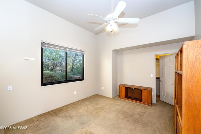 5327 N Ventana Overlook Pl, Tucson, AZ 85750 - interior space with a towering ceiling, a walk in closet, a ceiling fan, and light colored carpet