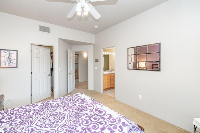 5327 N Ventana Overlook Pl, Tucson, AZ 85750 - bedroom with visible vents, ceiling fan, ensuite bath, and light colored carpet