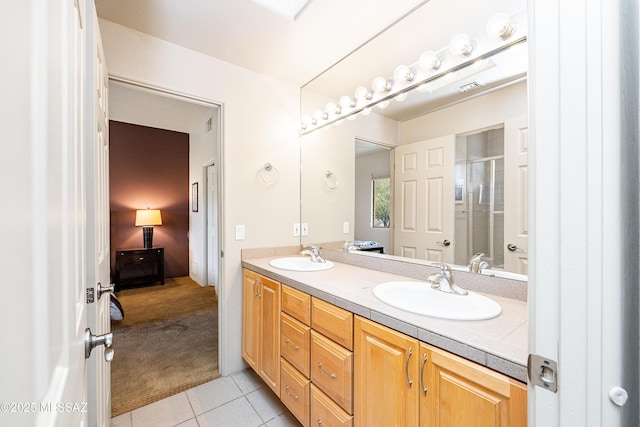 5327 N Ventana Overlook Pl, Tucson, AZ 85750 - ensuite bathroom with a sink, tile patterned flooring, a stall shower, and double vanity