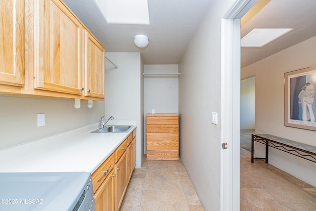 5327 N Ventana Overlook Pl, Tucson, AZ 85750 - washroom featuring laundry area, a sink, and a skylight