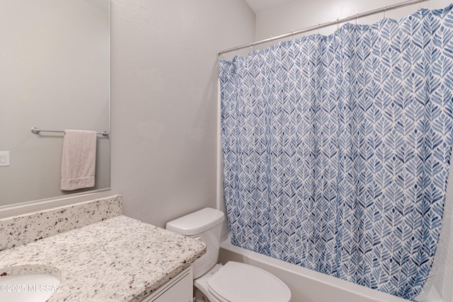 full bath featuring vanity, toilet, and shower / tub combo