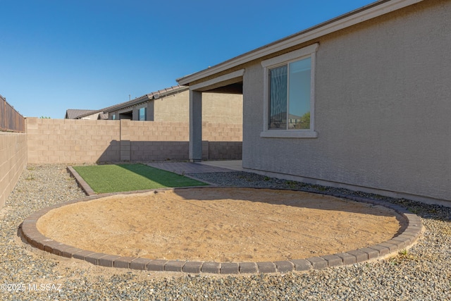 view of yard featuring a patio and a fenced backyard