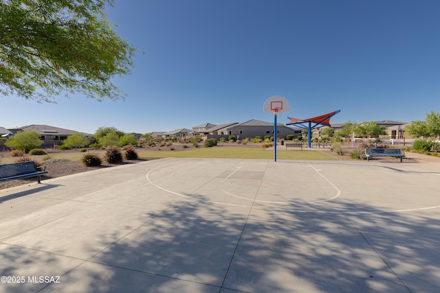 view of basketball court with a residential view and community basketball court