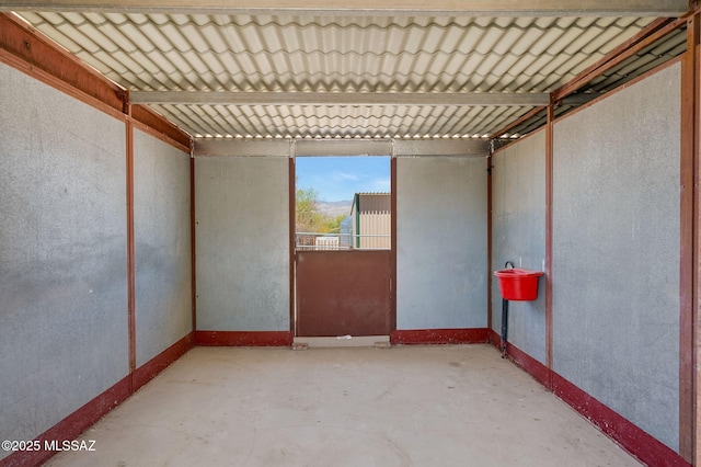 empty room featuring unfinished concrete floors