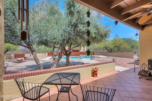 view of patio featuring fence and a community pool