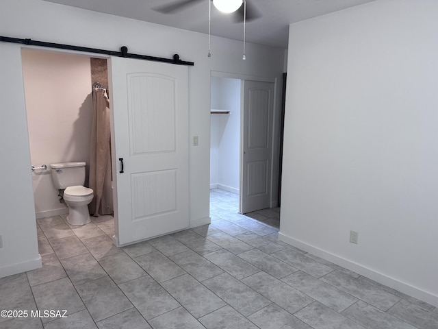 419 N Miller Ln, Saint David, AZ 85630 - interior space featuring a shower with curtain, toilet, a ceiling fan, and tile patterned floors