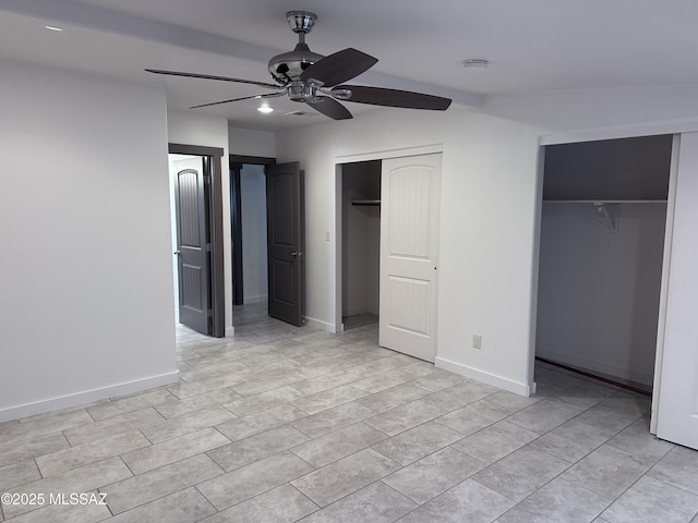 419 N Miller Ln, Saint David, AZ 85630 - unfurnished bedroom with ceiling fan, baseboards, multiple closets, and visible vents