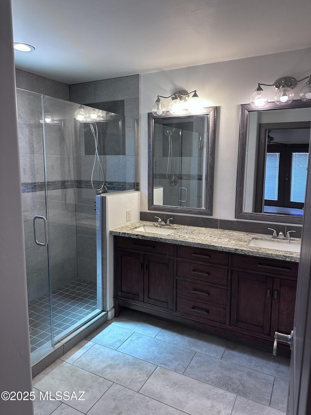 419 N Miller Ln, Saint David, AZ 85630 - full bath featuring a shower stall, tile patterned floors, a sink, and double vanity