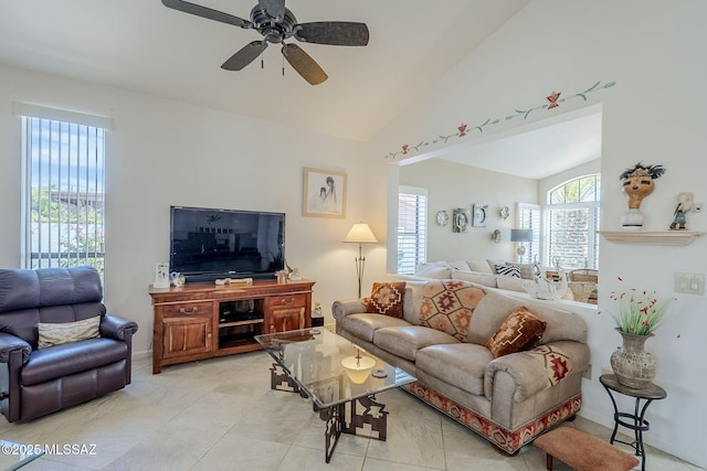 living room featuring ceiling fan, vaulted ceiling, and light tile patterned flooring