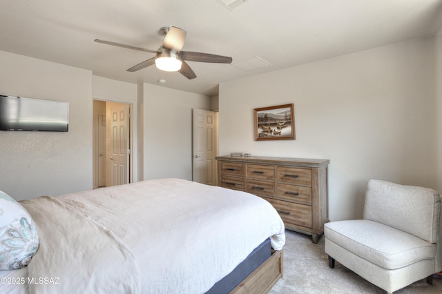 bedroom with ceiling fan and light carpet