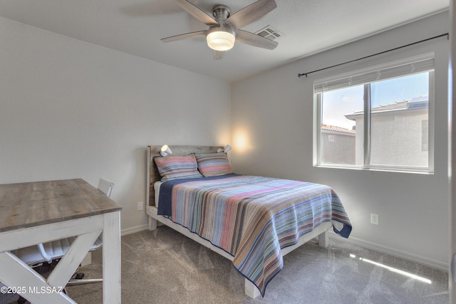 carpeted bedroom featuring a ceiling fan, baseboards, and visible vents