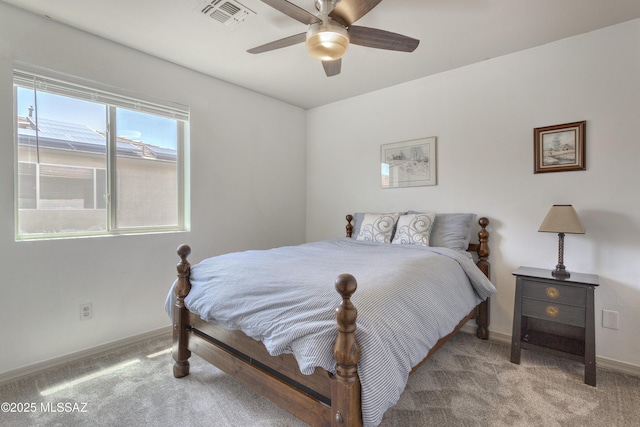 carpeted bedroom with baseboards, ceiling fan, and visible vents