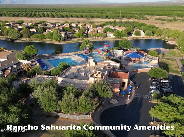 birds eye view of property with a water view