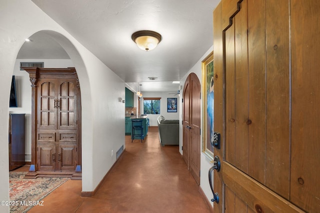 901 W Las Lomitas Rd, Tucson, AZ 85704 - hallway with concrete floors and arched walkways