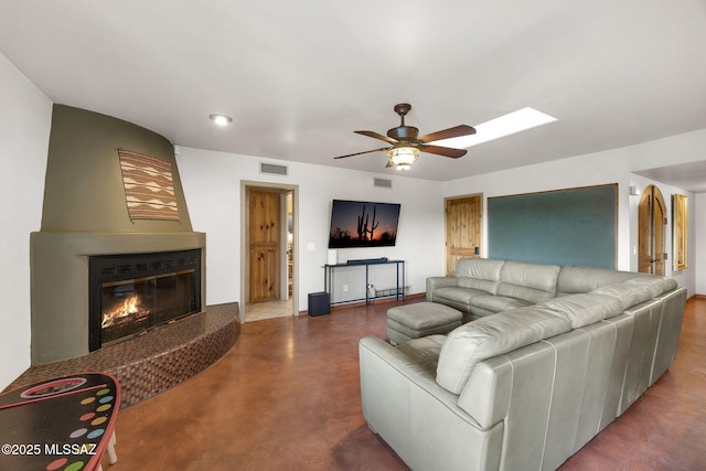 901 W Las Lomitas Rd, Tucson, AZ 85704 - living room featuring a ceiling fan, a glass covered fireplace, recessed lighting, and a skylight