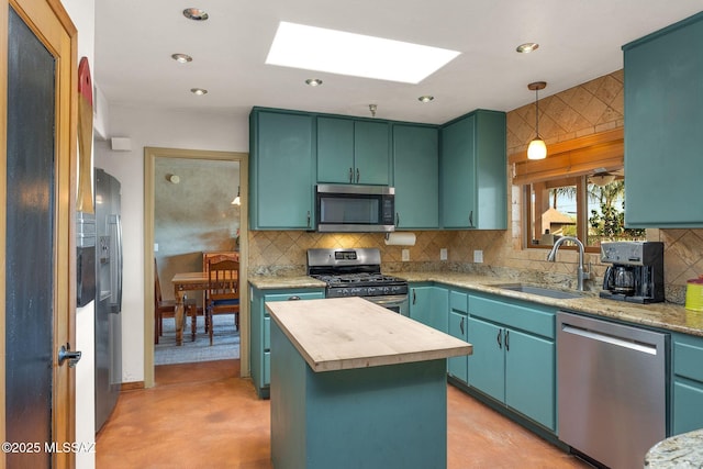 901 W Las Lomitas Rd, Tucson, AZ 85704 - kitchen featuring appliances with stainless steel finishes, a skylight, decorative backsplash, butcher block counters, and pendant lighting