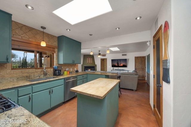901 W Las Lomitas Rd, Tucson, AZ 85704 - kitchen with stainless steel dishwasher, a skylight, wooden counters, decorative backsplash, and open floor plan