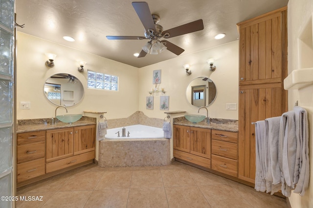 901 W Las Lomitas Rd, Tucson, AZ 85704 - bathroom featuring two vanities, tile patterned flooring, a garden tub, and ceiling fan